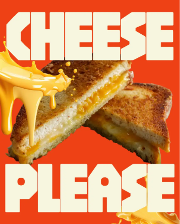 A grilled cheese sandwich sliced at a diagonal over a red background