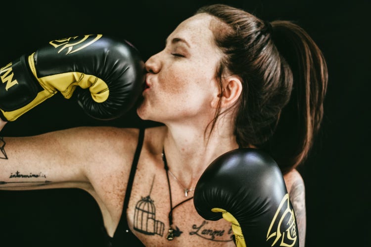 Free to use images: woman kissing her boxing gloves