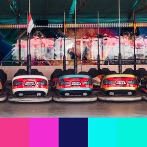 A color palette created from an image of white, blue, and yellow bumper cars in front of a colorful neon wall