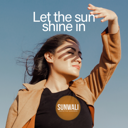 A woman shielding her eyes from the sun