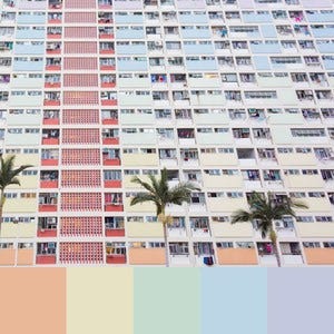 A color palette created from an image of an apartment complex with red, orange, yellow, green, and blue balconies