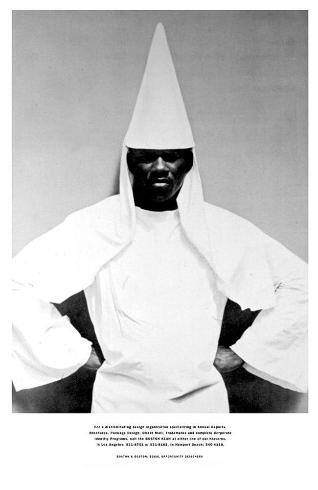 Black and white promotional image of a Black man wearing a white Klu Klux Klan robe with his fists at his hips. Text under the image reads, "For a discriminating design organization.... call the Boston Klan."