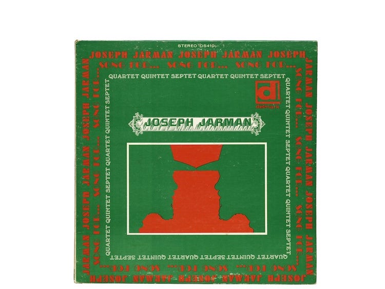An album cover with a green background featuring a green mirror image sihlouette of a person wearing a hat at center on a red backgorund. The artist's name, Joseph Jarman, has a decorative frame at center and repeated text in red and white frames the entire cover.