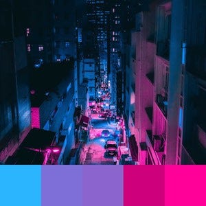 A color palette created from an image of a city at night with pink, purple, and blue reflecting lights