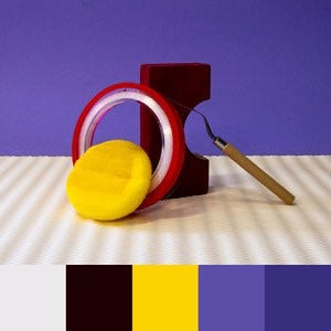 A color palette created from an image of yellow, red, white, and brown objects posed against a light purple background