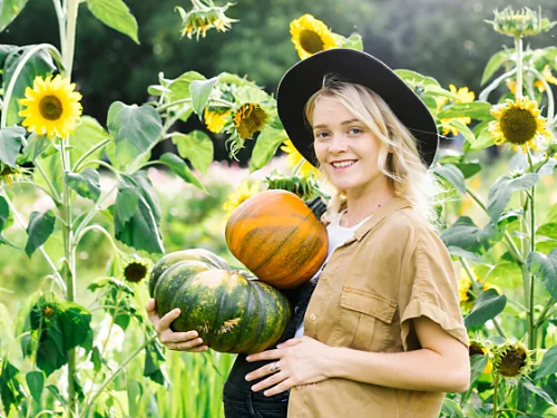 A solo maternity photo with a fall theme.