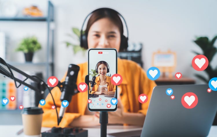 person in front a cellphone during a Livestreaming