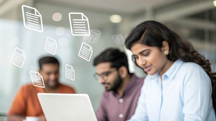Team reviewing data and insights on a digital dashboard, illustrating how AI supports productivity and decision-making.