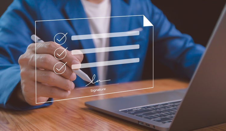 Digital signature concept showing electronic signing of documents on a virtual laptop screen with a stylus pen.