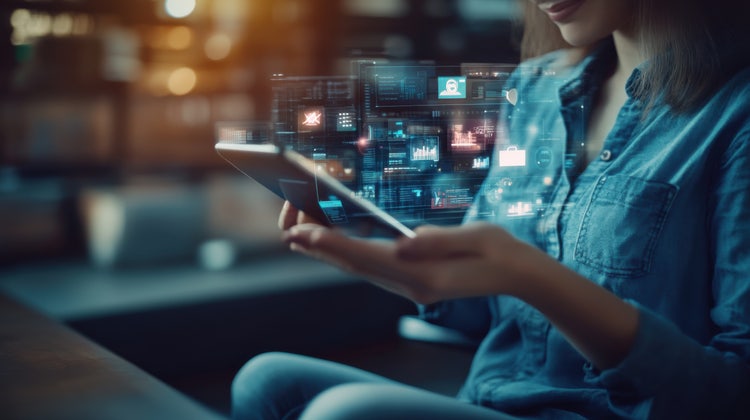 A cross-platform marketing strategist plans campaigns on various devices, focusing on multi-channel marketing with detailed charts visible.