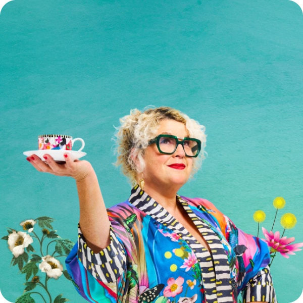 A woman holding up a tea cup