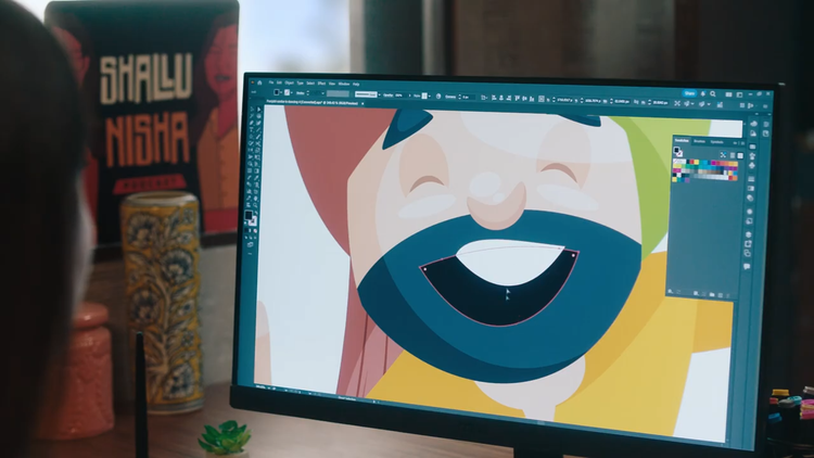 Designer is creating and editing illustrations/vectors with Adobe Illustrator.