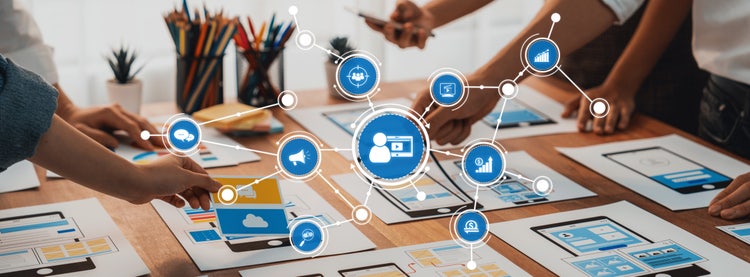 Diverse team collaborating on marketing strategy in a modern workspace.