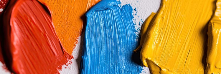 Close-up of paint strokes Red, Blue, and Yellow - primary colours.