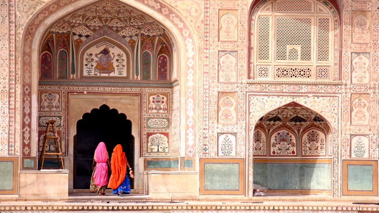 Women walking inside Amber Fort, Jaipur, symbolising the fusion of traditional Indian culture and contemporary design themes explored in Photoshop.