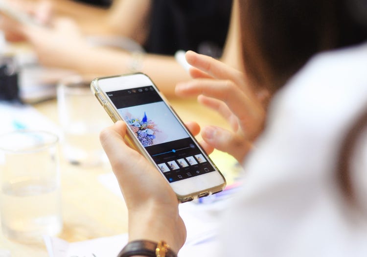 Editing photos on smartphone.