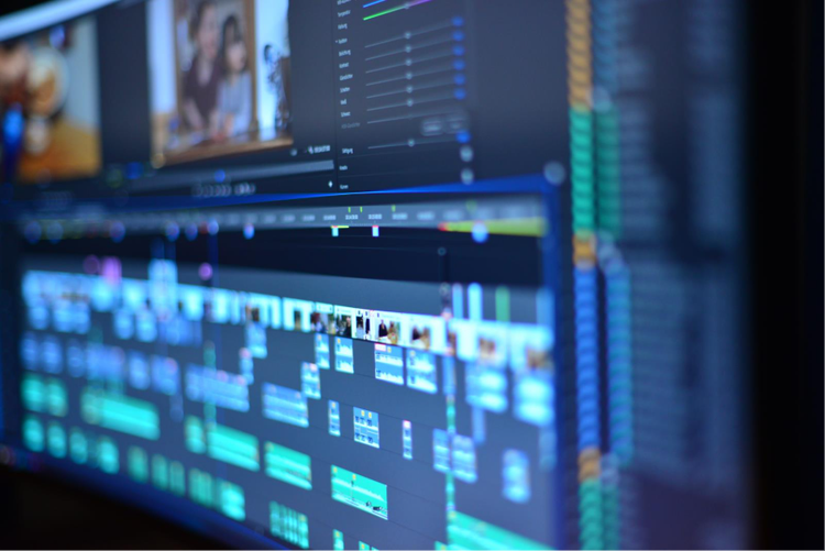 A closeup of Adobe Premiere timeline, showing different clips being edited.
