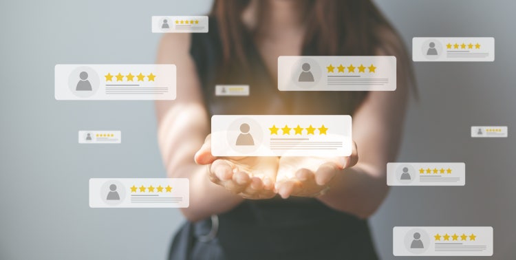 An image of a woman holding out her hands with multiple good rating testimonial bubbles floating on the screen.