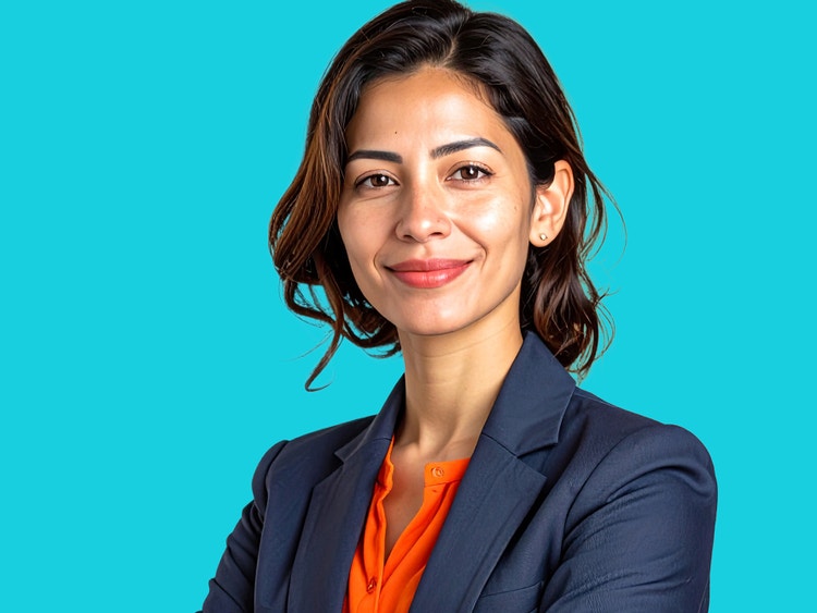 AI फे़स जनरेटर से बनाया गया एक कॉमर्शियल स्टाइल का हेडशॉट, जिसमें एक महिला नेवी सूट जैकेट और नारंगी शर्ट पहने हुए है।