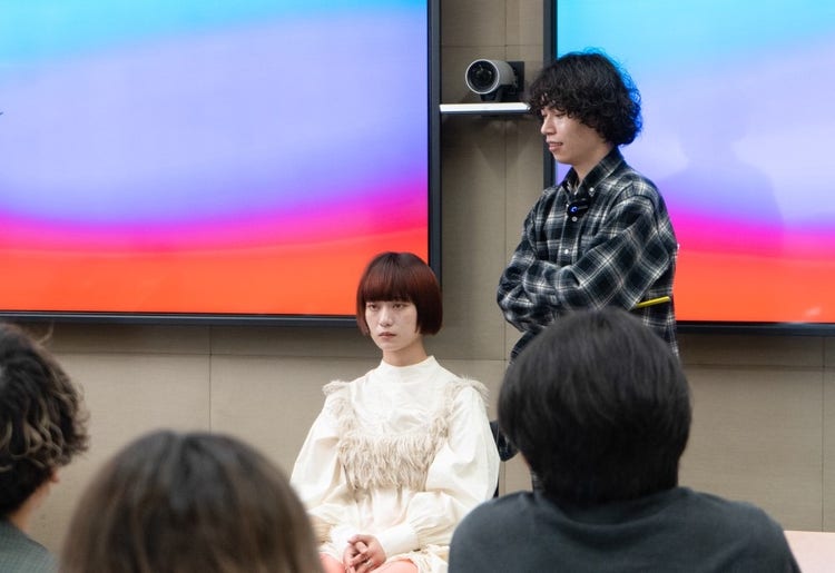 A picture containing person, person, standing, crowd Description automatically generated