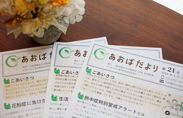 Several papers on a table Description automatically generated