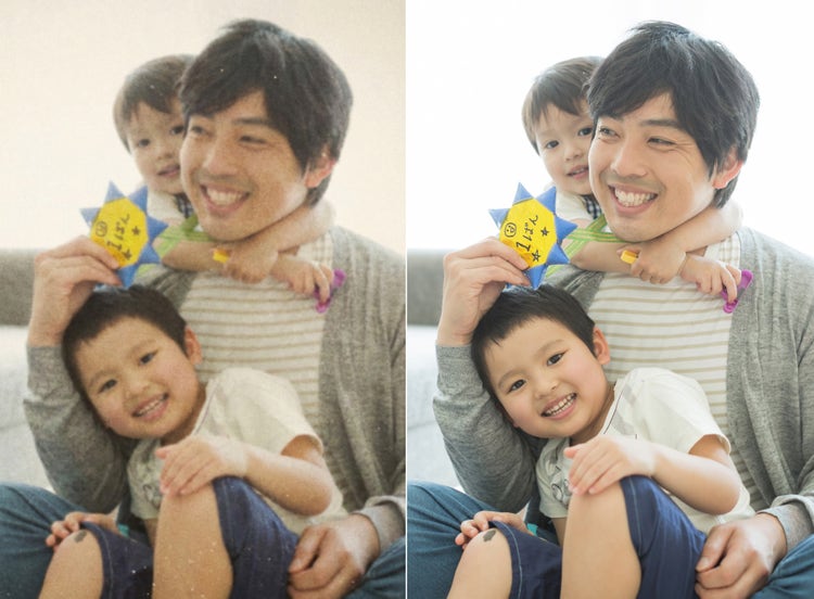 室内で大人と複数の子どもが並んで座っている様子