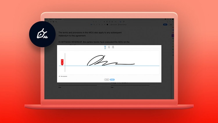 A handwritten signature on a laptop against a red background.