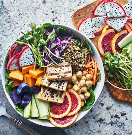 Colorful food image of a grilled tofu salad with dragonfruit and blood oranges