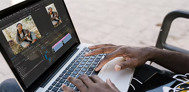 A person editing a video in Adobe {{premiere}} on their laptop