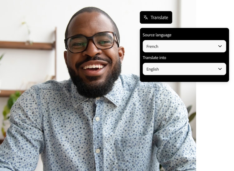 A man in a blue shirt smiles into the camera with AI translation tool overlay set to translate French into English.