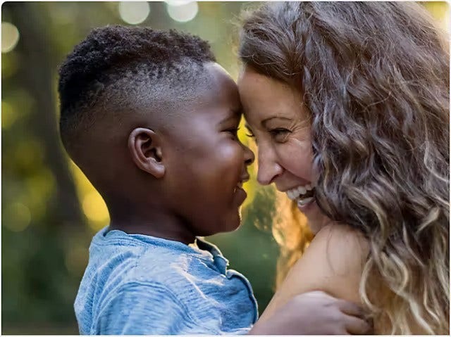 A woman and child smiling