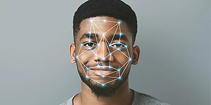 A man's face with motion capture points superimposed over him