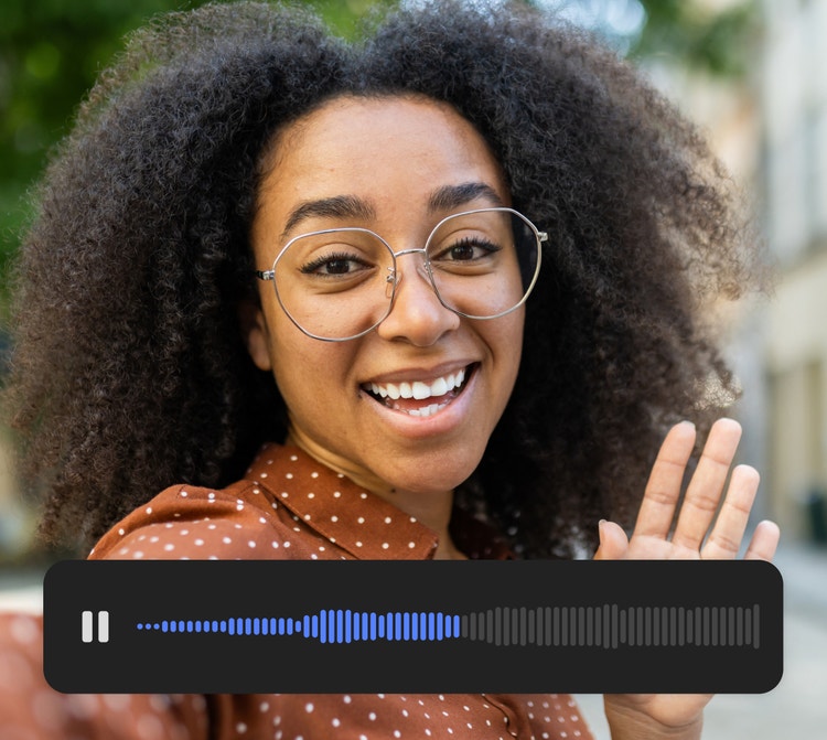 A young woman gesturing to and speaking to the camera with audio UI visible in the lower third of the image.