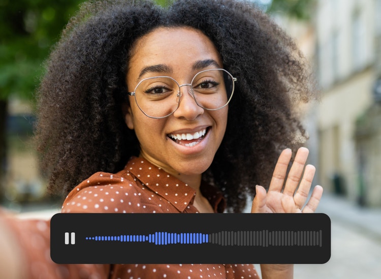 A young woman gesturing to and speaking to the camera with audio UI visible in the lower third of the image.