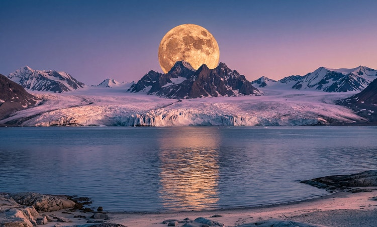 A full moon shines over an Arctic landcape.