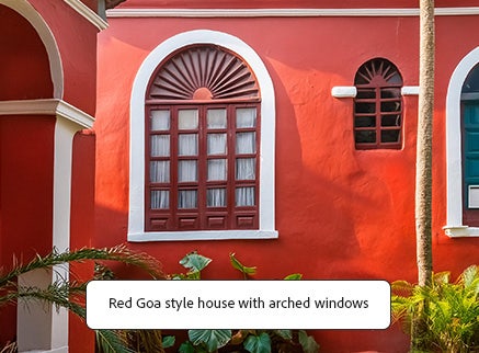 AI generated photo of a read Goa style house and the garden