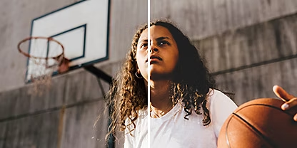 A photo of a young basketball player posing in front of a basketball hoop, with the Adobe Photoshop Lightroom &quot;Matte&quot; preset applied to the right half of the photo