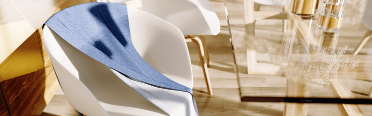 Blue fabric laid over formed white chairs