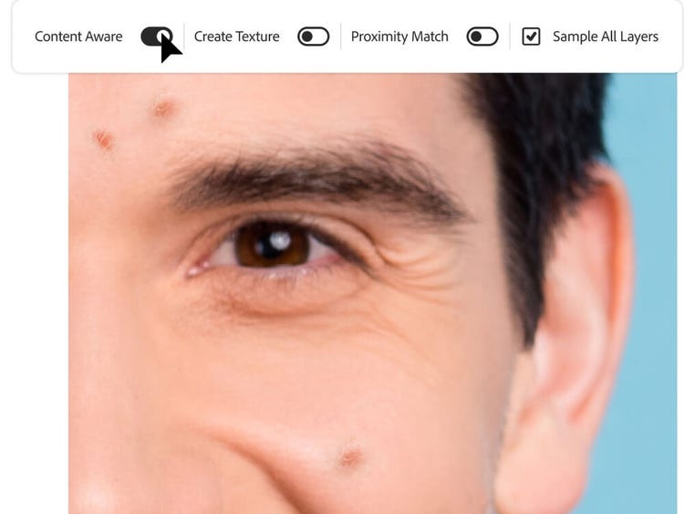 Opções sendo selecionadas para remover manchas do rosto de um homem., Picture