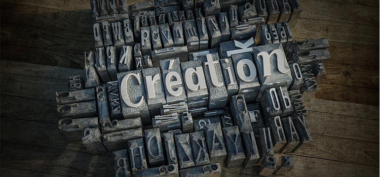 Oluşturma sözcüğünü oluşturan blok baskı grafiği.