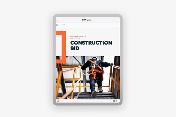 The cover page of a construction bid proposal being mocked up on a tablet