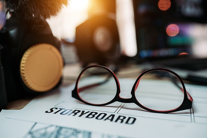 Pair of glasses resting atop a storyboard template.
