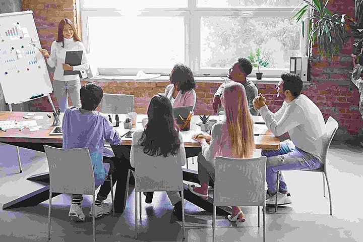 A pixelated stock image of people in an office, after compression