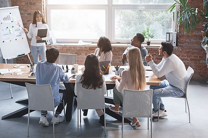 A stock photo of people in an office, before image compression