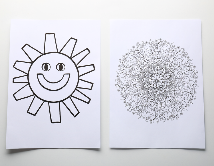 Two AI-generated colouring pages side by side — a bold simple sun outline for young children on the left and an intricate mandala pattern for adults on the right