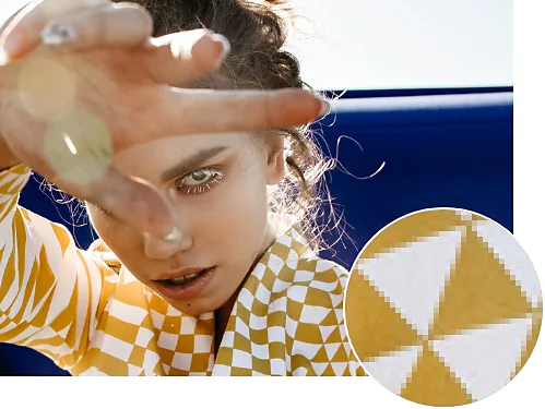 A photo of a person. The person's shirt has been zoomed in to show pixels.