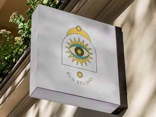 An image of a shop sign with the shop's logo.