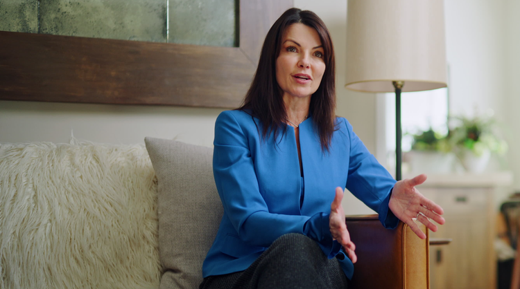 Real estate agent Angi Ciccarelli, speaking interview style to someone off screen.