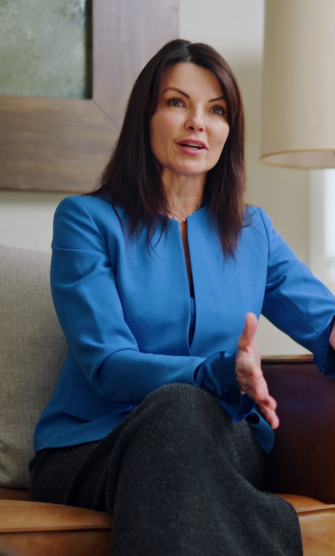 Real estate agent Angi Ciccarelli, speaking interview style to someone off screen.