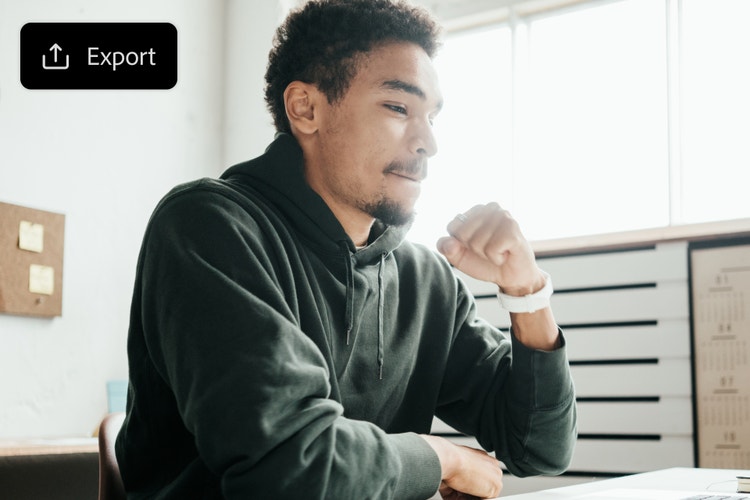 An image of a young man reviewing English to French translation in the AI audio translation tool